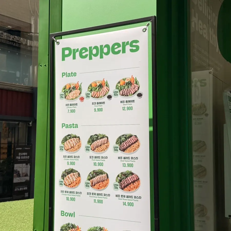 Menu board at Prefers Nowon Station branch listing salads, poke, and pasta