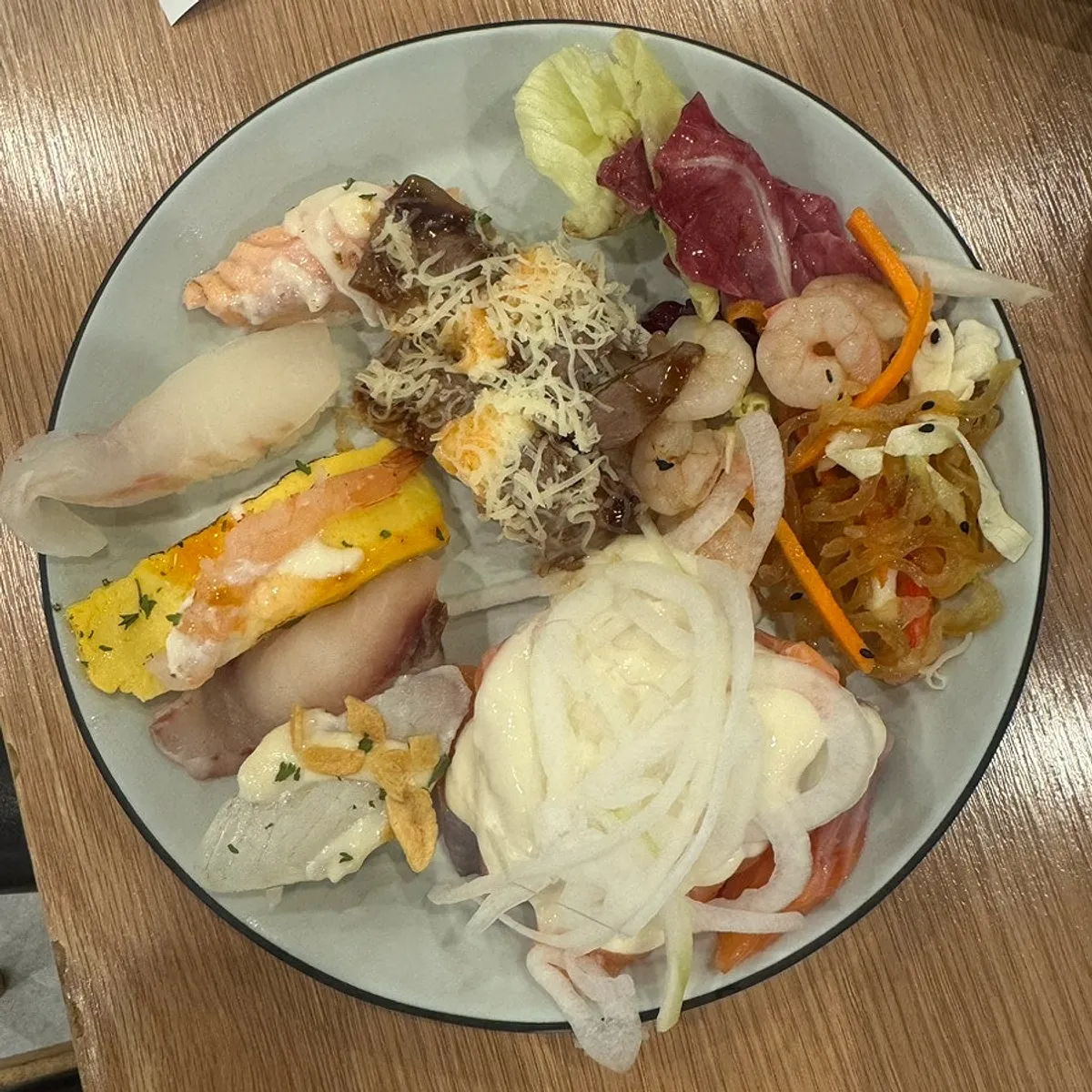 First plate filled with fresh salmon sashimi