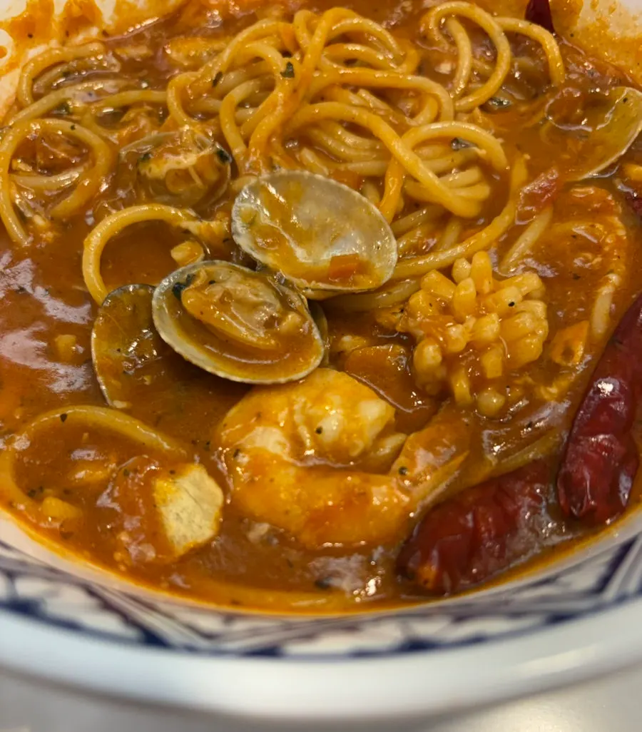 Seafood tomato pasta with garlic chips