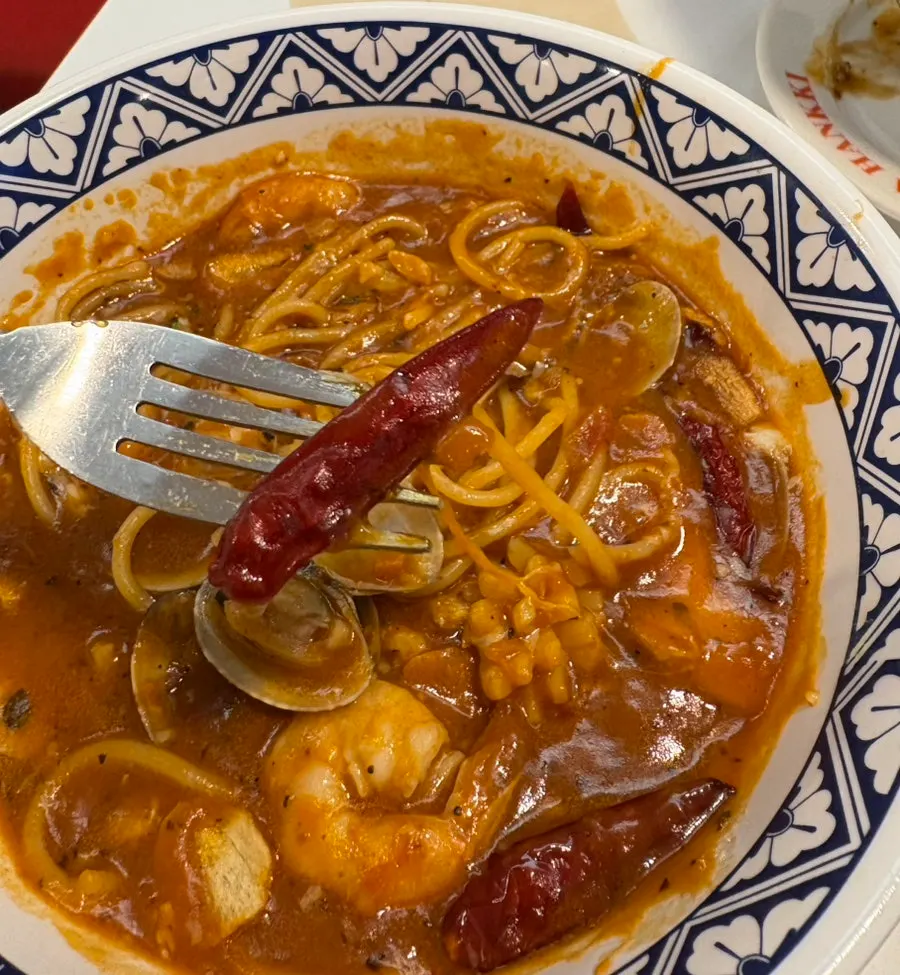 Noodles in spicy seafood tomato pasta