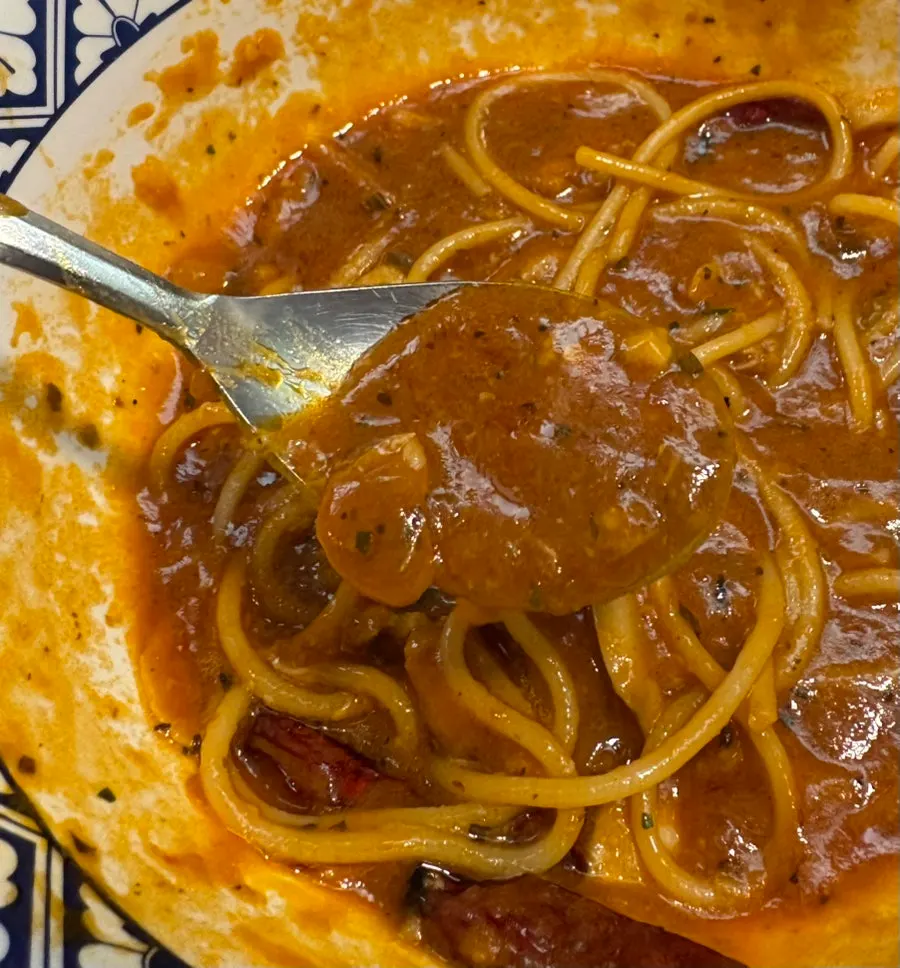 Tomato pasta with seafood and noodles