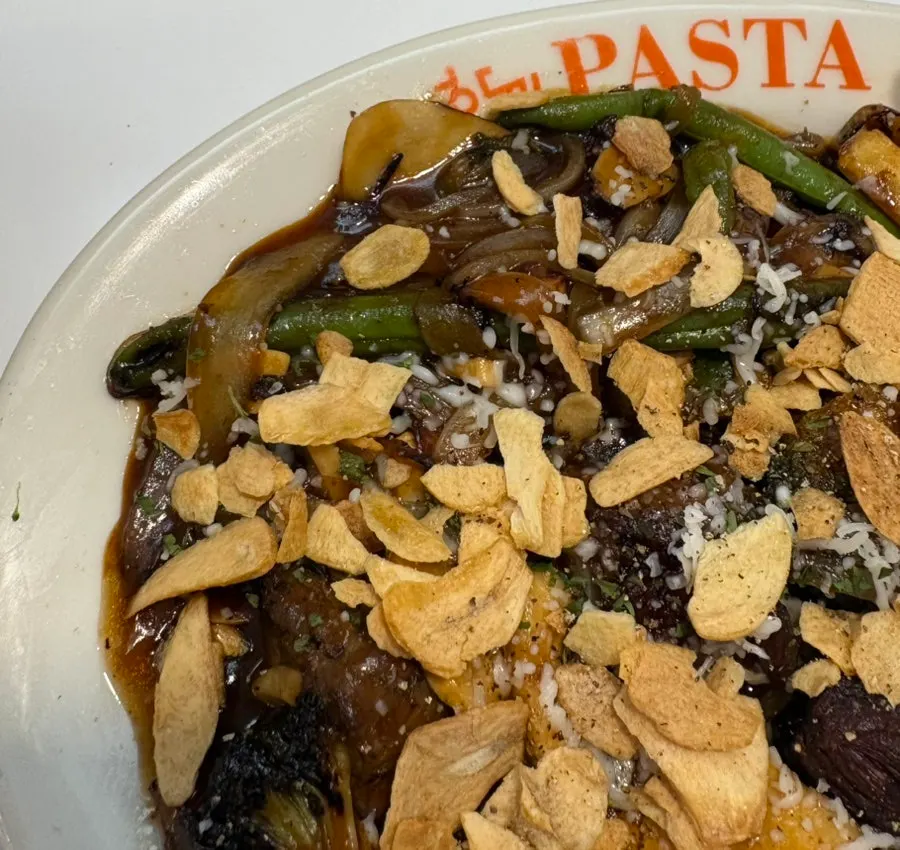 A plate of BBQ sauce chopped steak