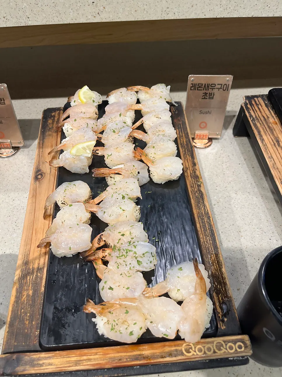 A plate with various types of shrimp sushi