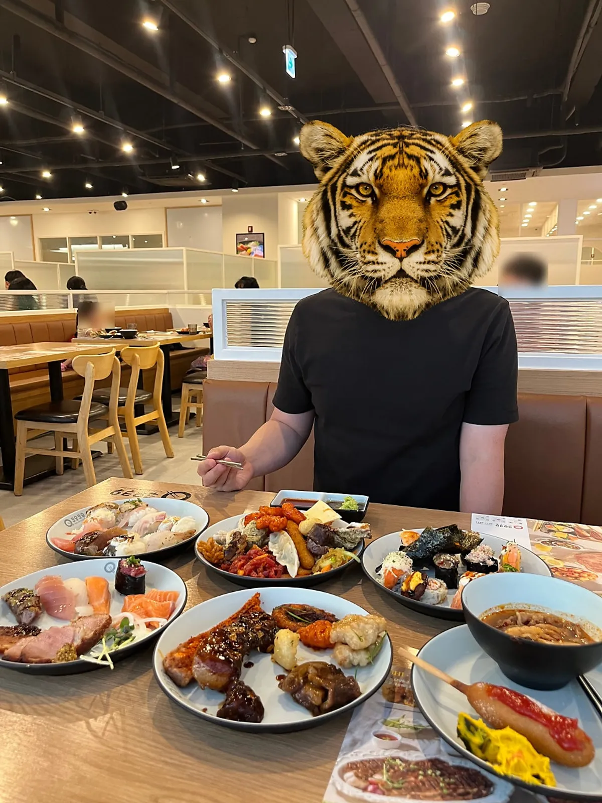 A first plate combining salad, meat, and sushi