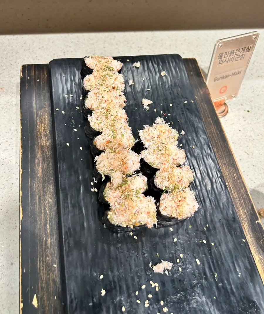 Various types of sushi laid out at the sushi corner