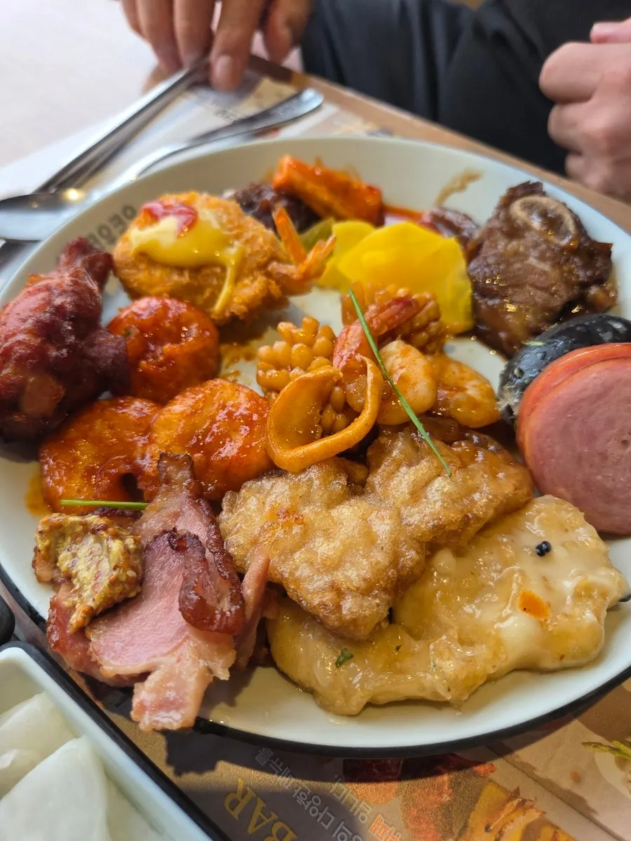 A plate filled with several kinds of sushi