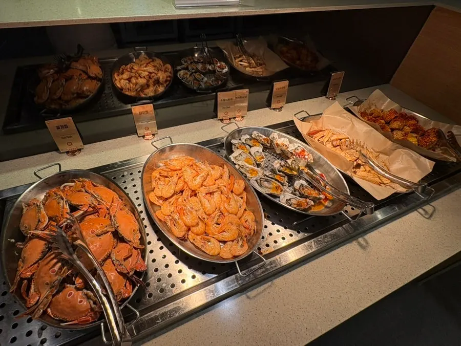 Sushi displayed on the buffet counter