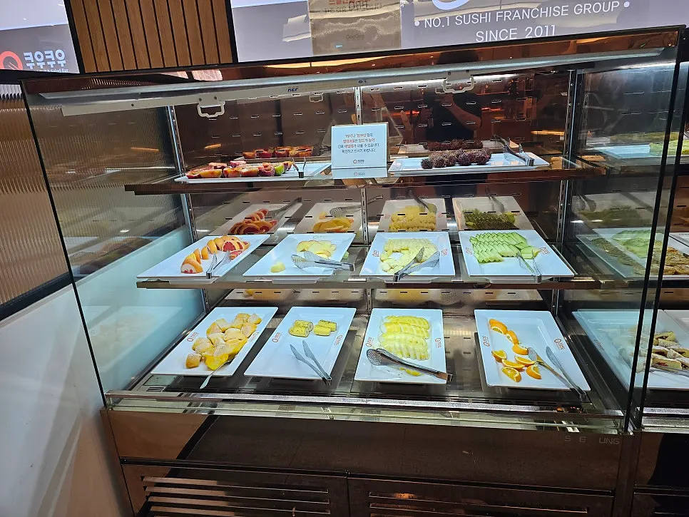 Dessert display case with fruit