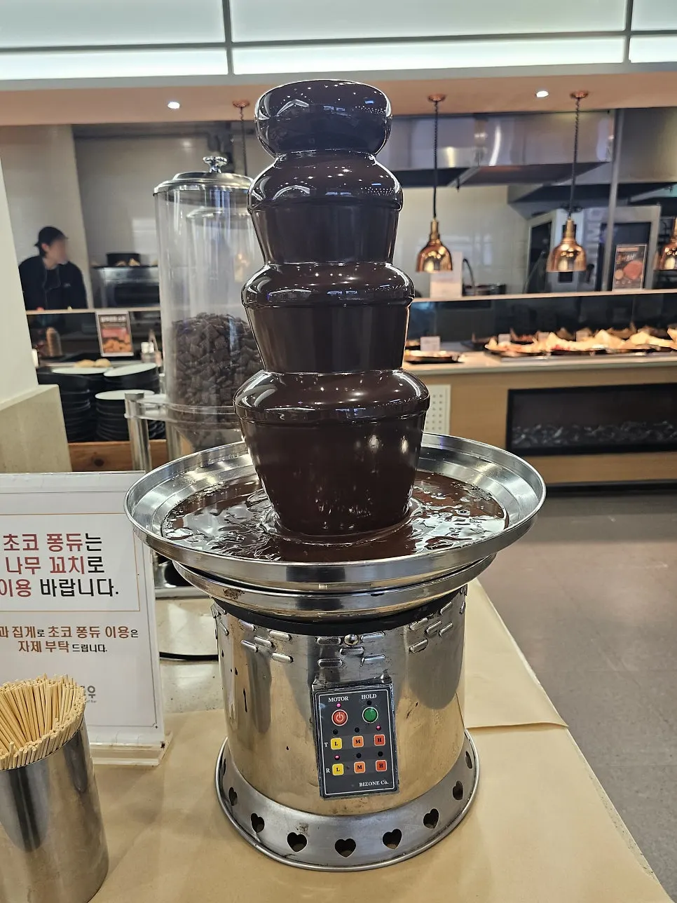 Dessert corner with chocolate fountain, waffles, and cereal