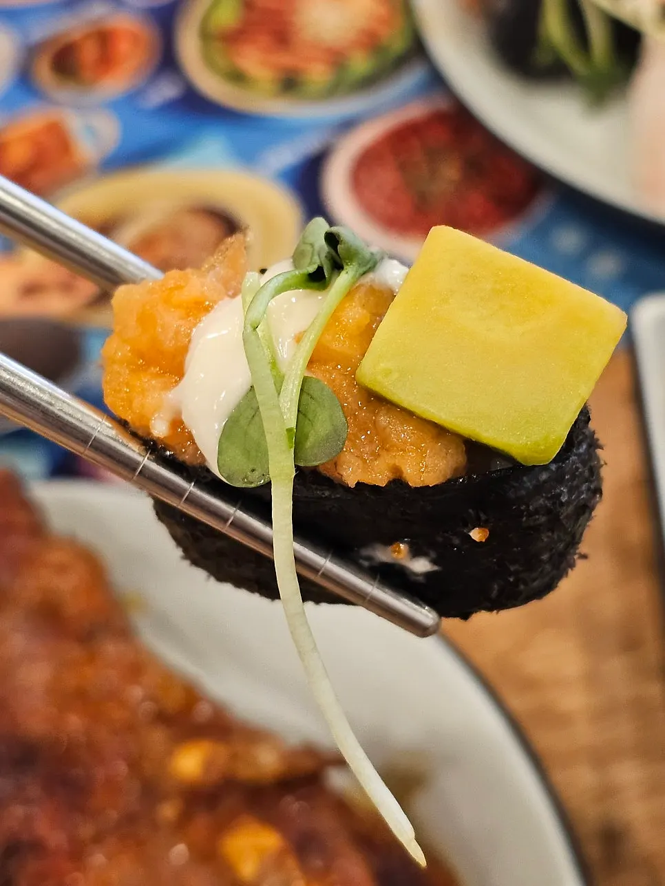 Salmon sushi that has gotten bigger in size