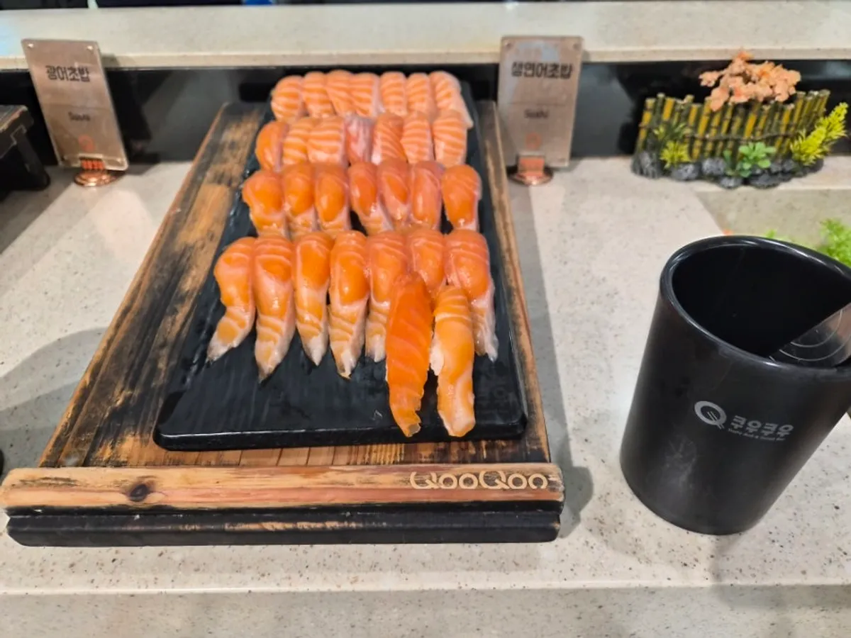 Salmon sushi and dessert dishes