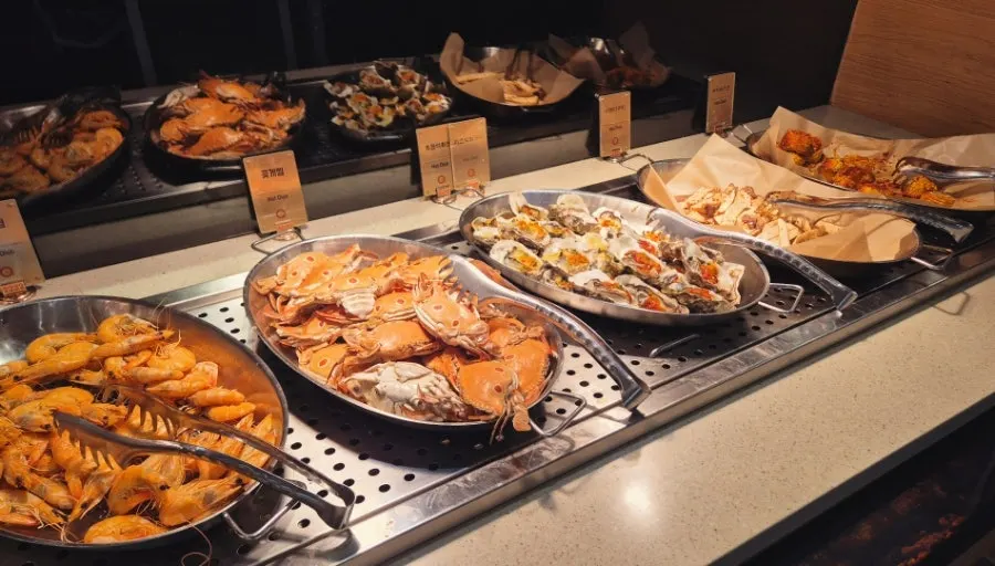 Buffet station with salad and seafood