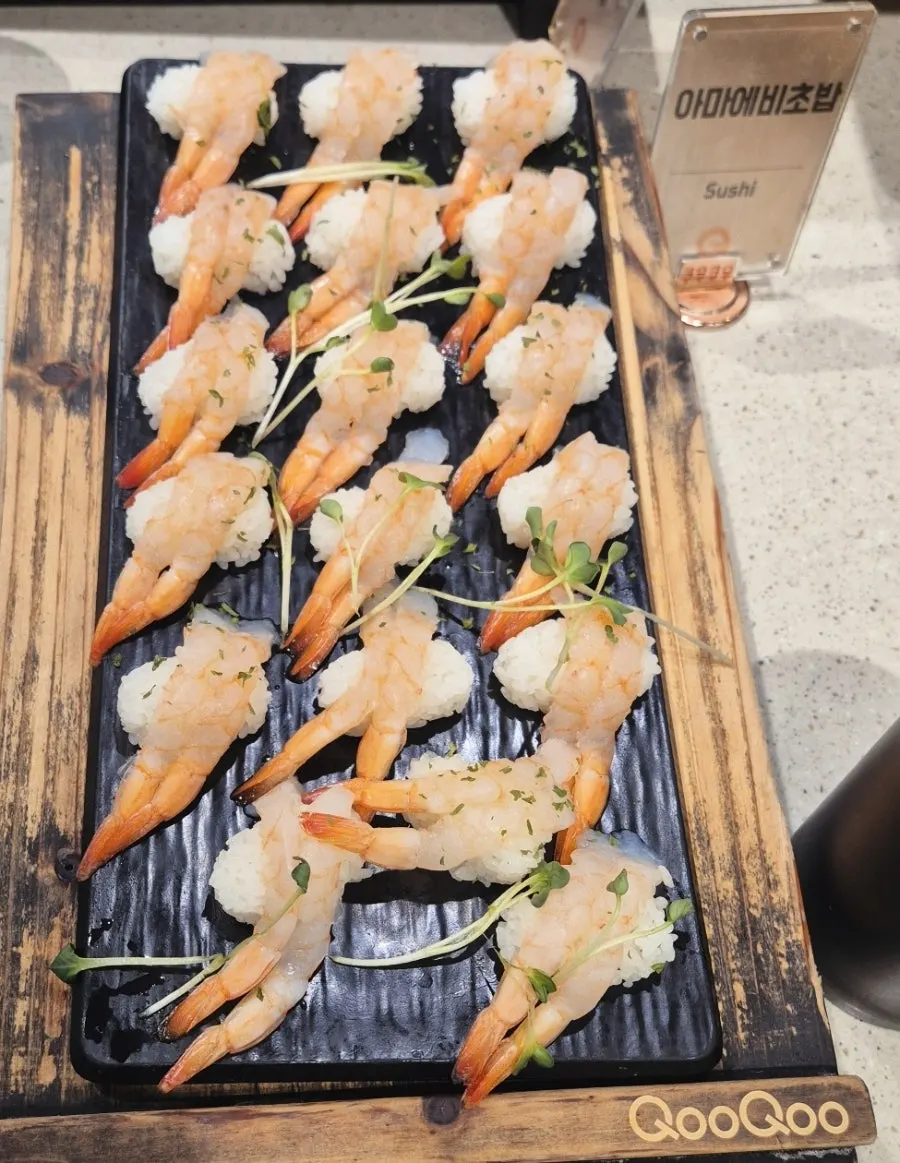 A plate of flounder sushi and salmon sushi