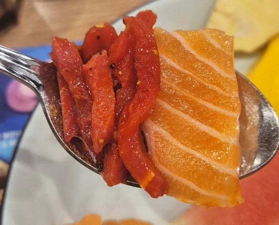 Extra salmon piled on top of sushi
