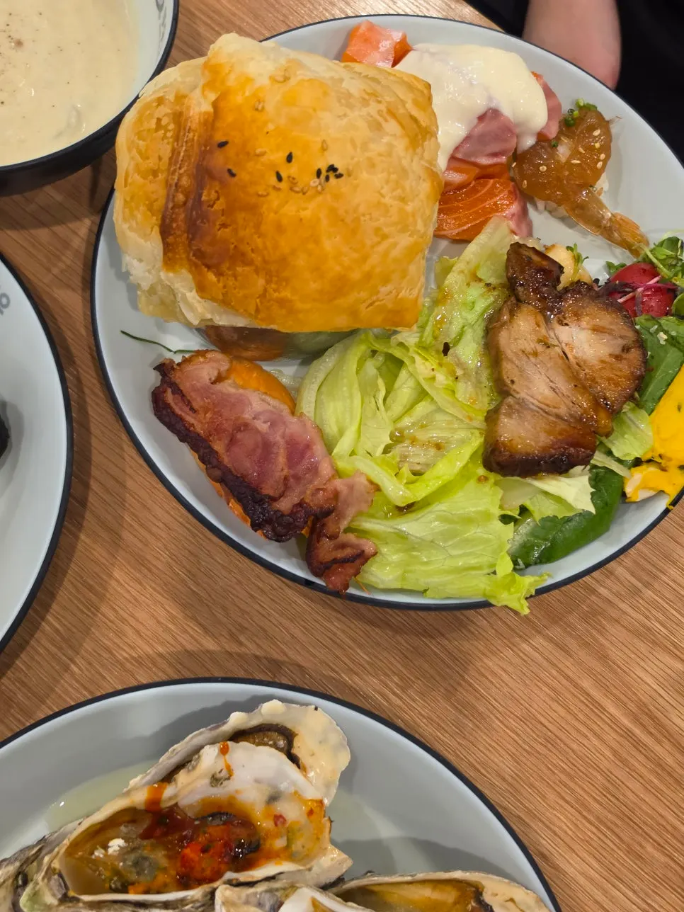 Friend's salad plate topped with soup en croute