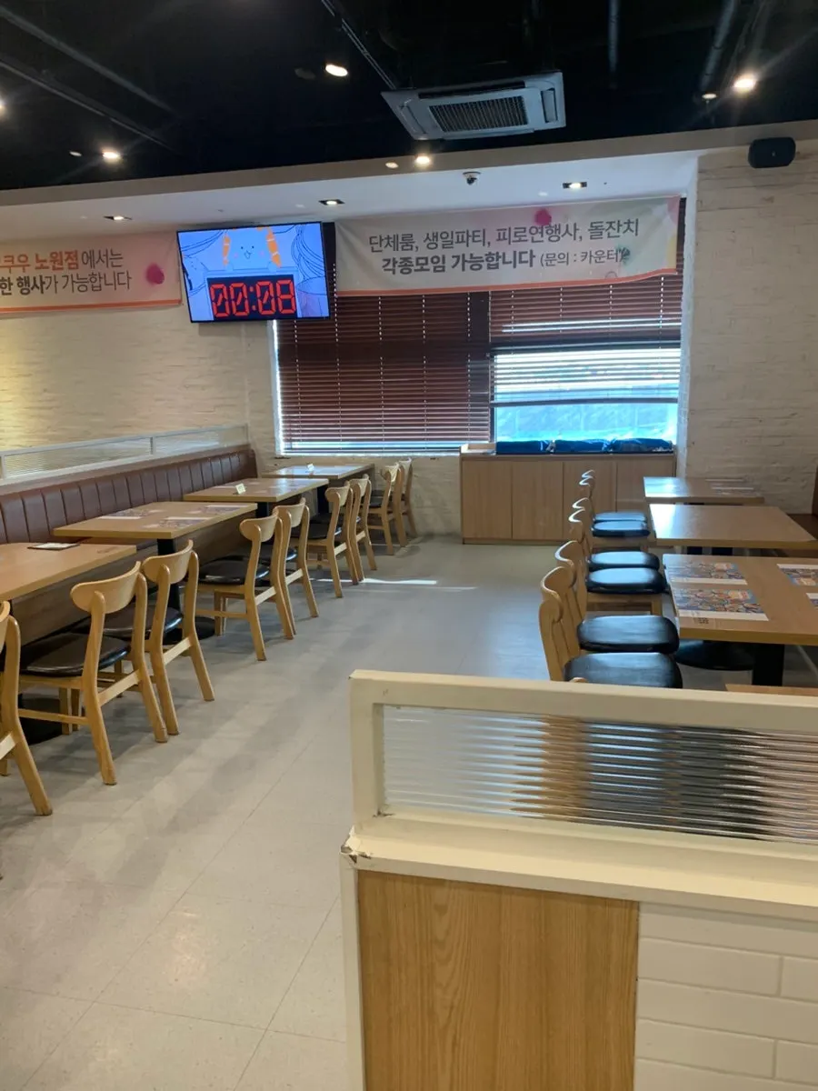 Spacious dining hall with white and wood tones