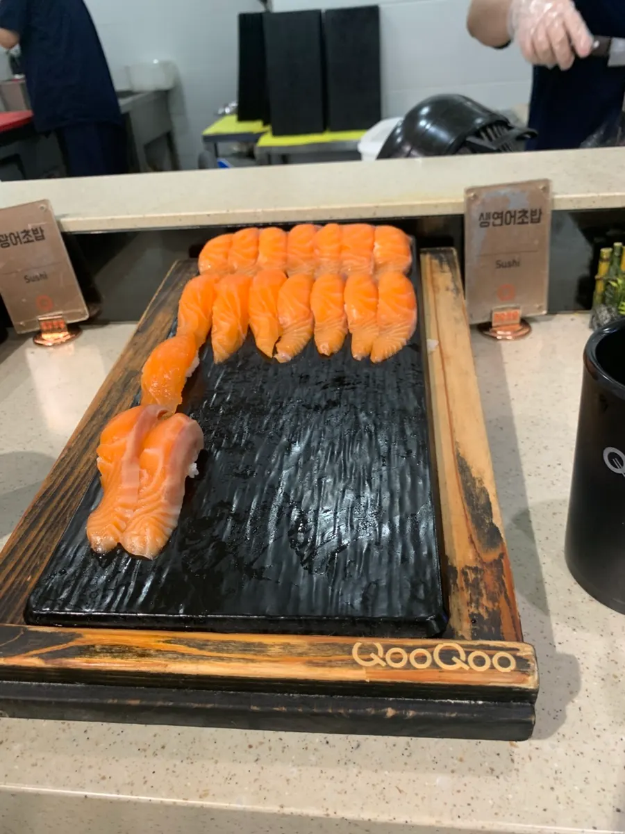 Plate of salmon sushi brought to the table