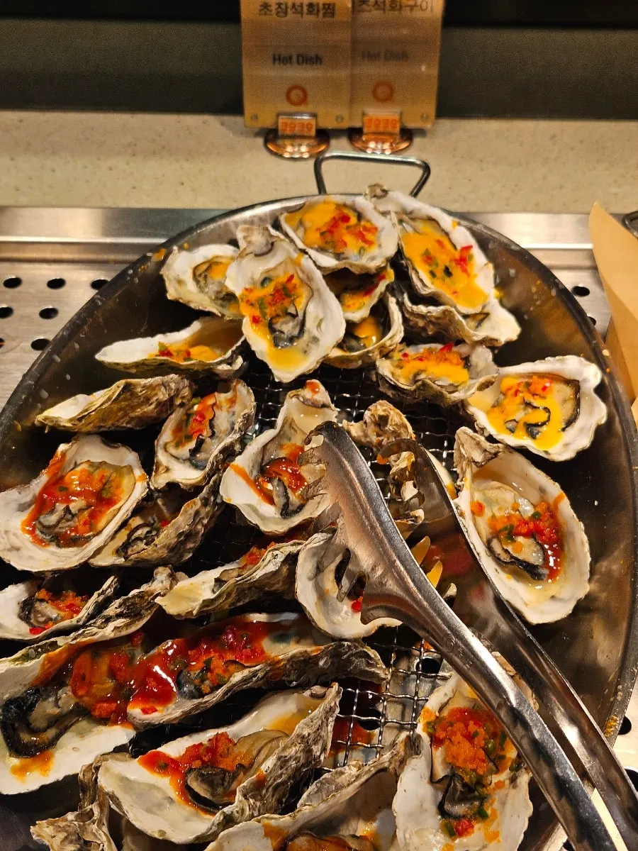 A seafood plate with steamed shrimp and steamed oysters