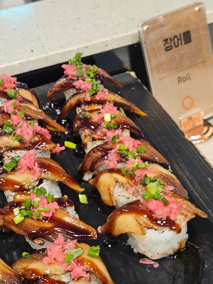 A sushi display with a variety of toppings
