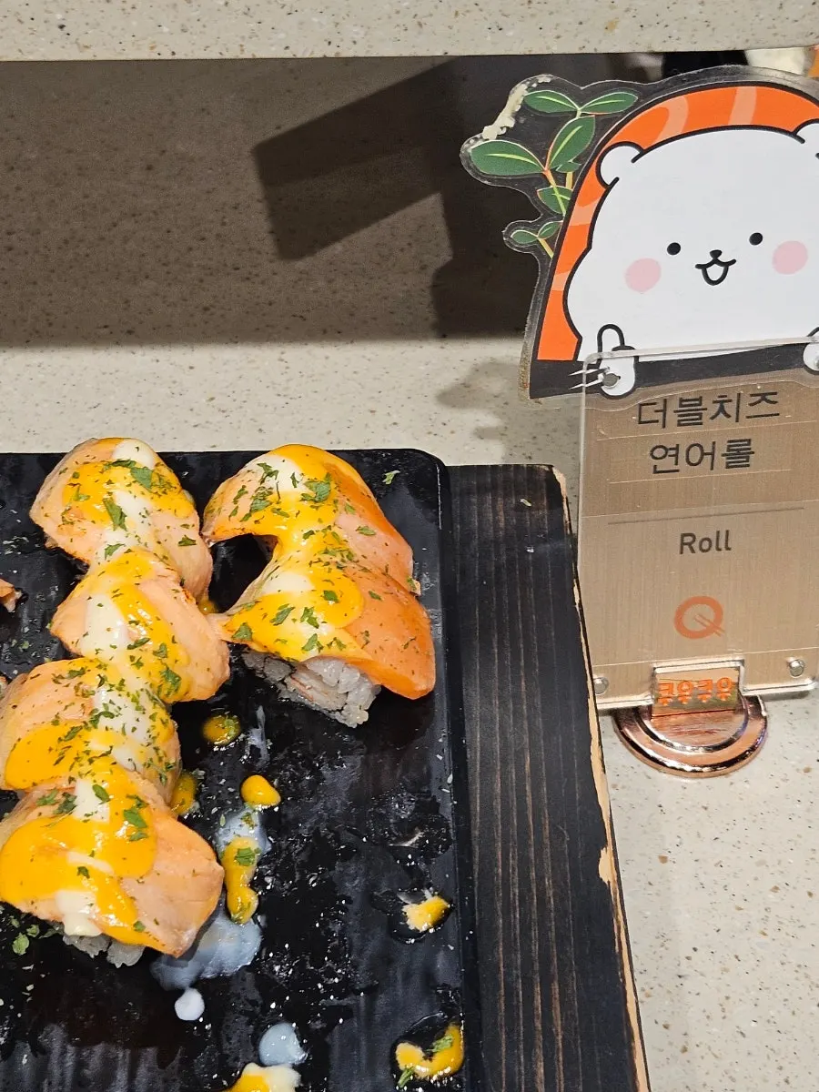 A plate combining sushi and sashimi