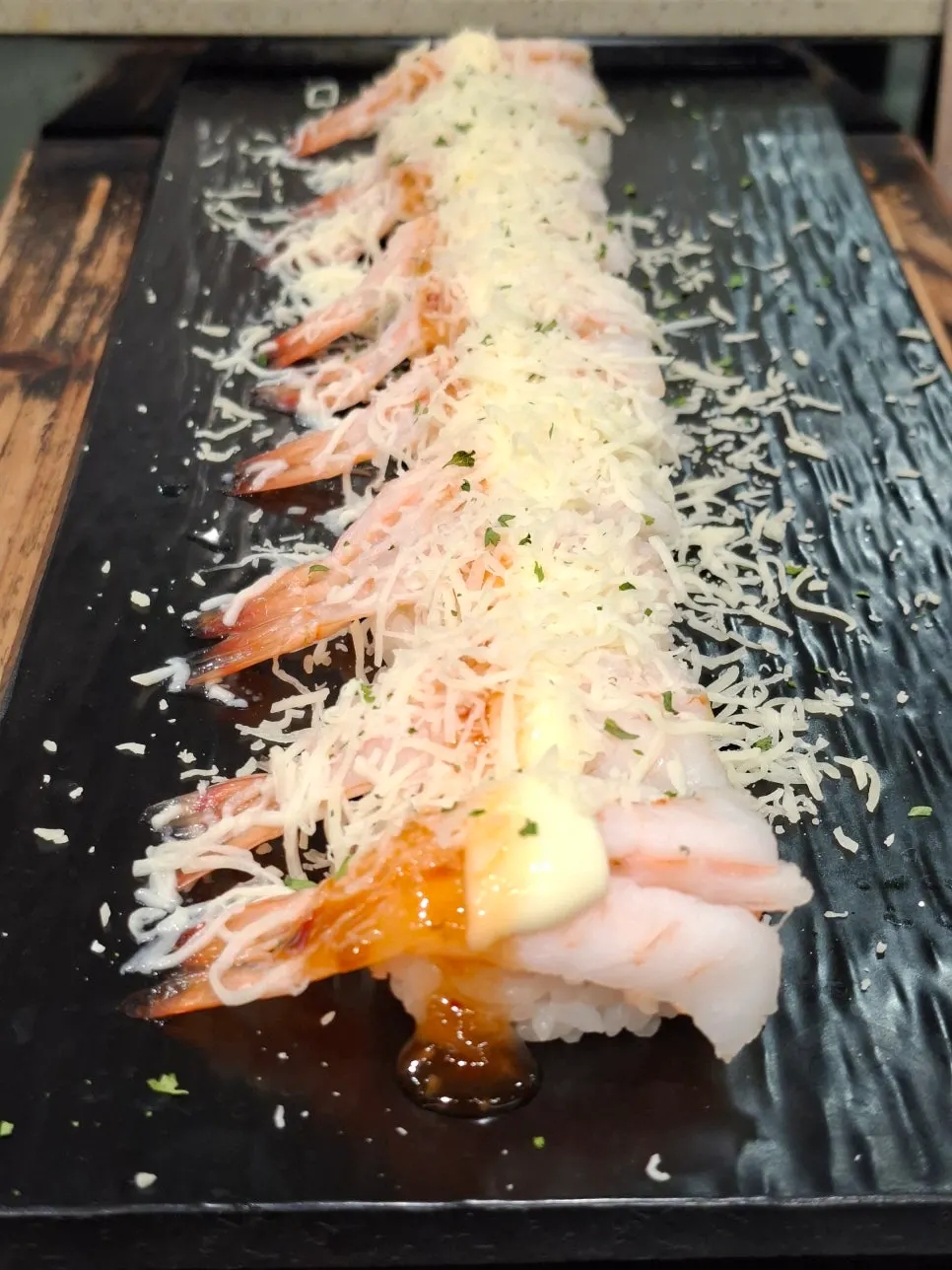 Selection of sushi, meat, and desserts