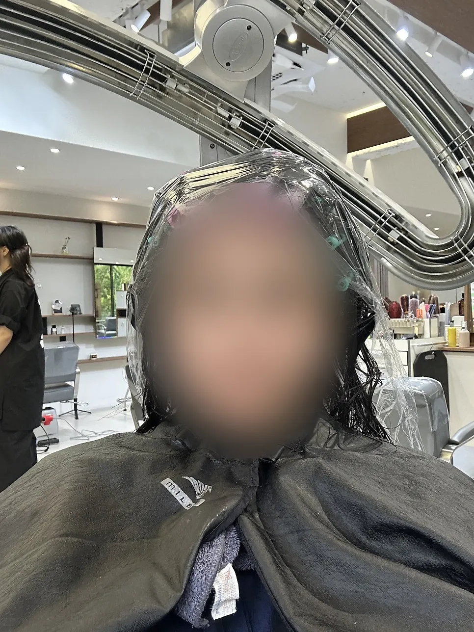 Treatment in progress, checking hair flow and flyaway sections