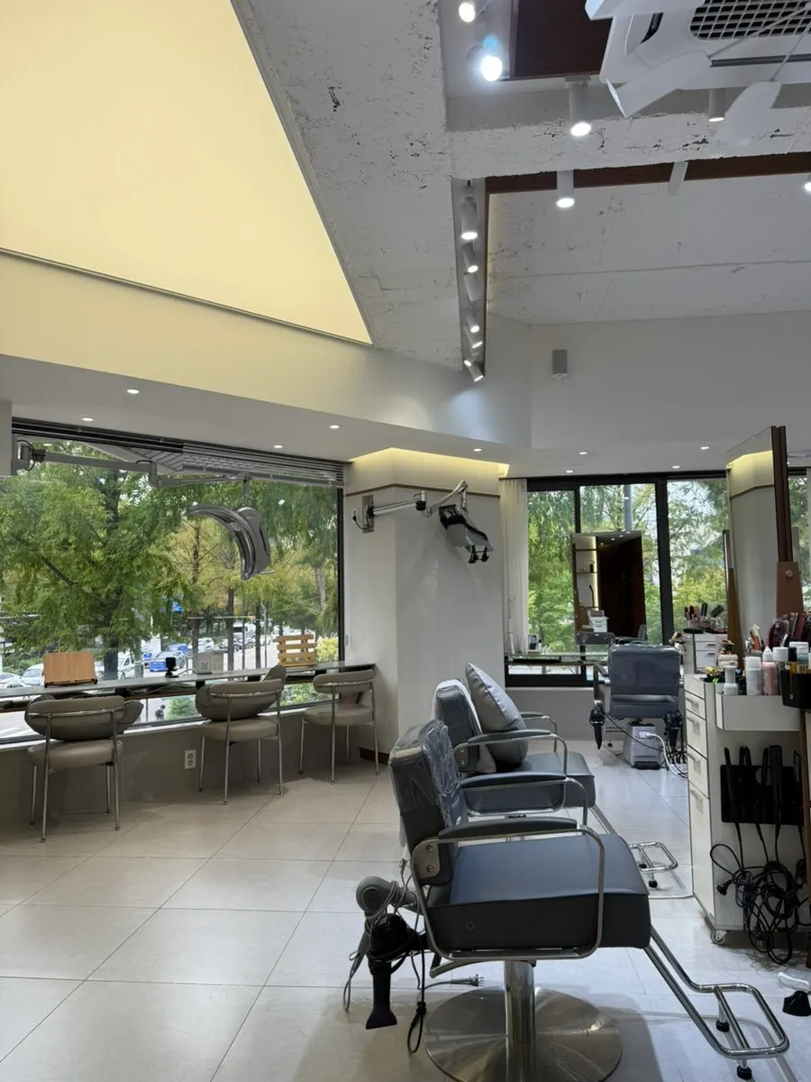 Interior of Yeum Hair Nowon District Office branch lit by large windows