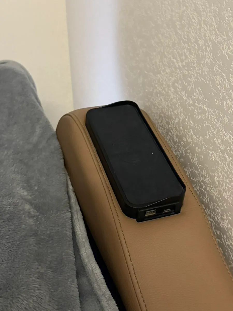 Massage chair in the care room with wireless charging