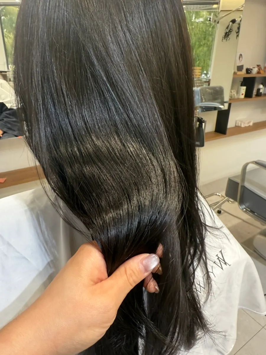 Back view showing the high layered cut and ash dark brown color