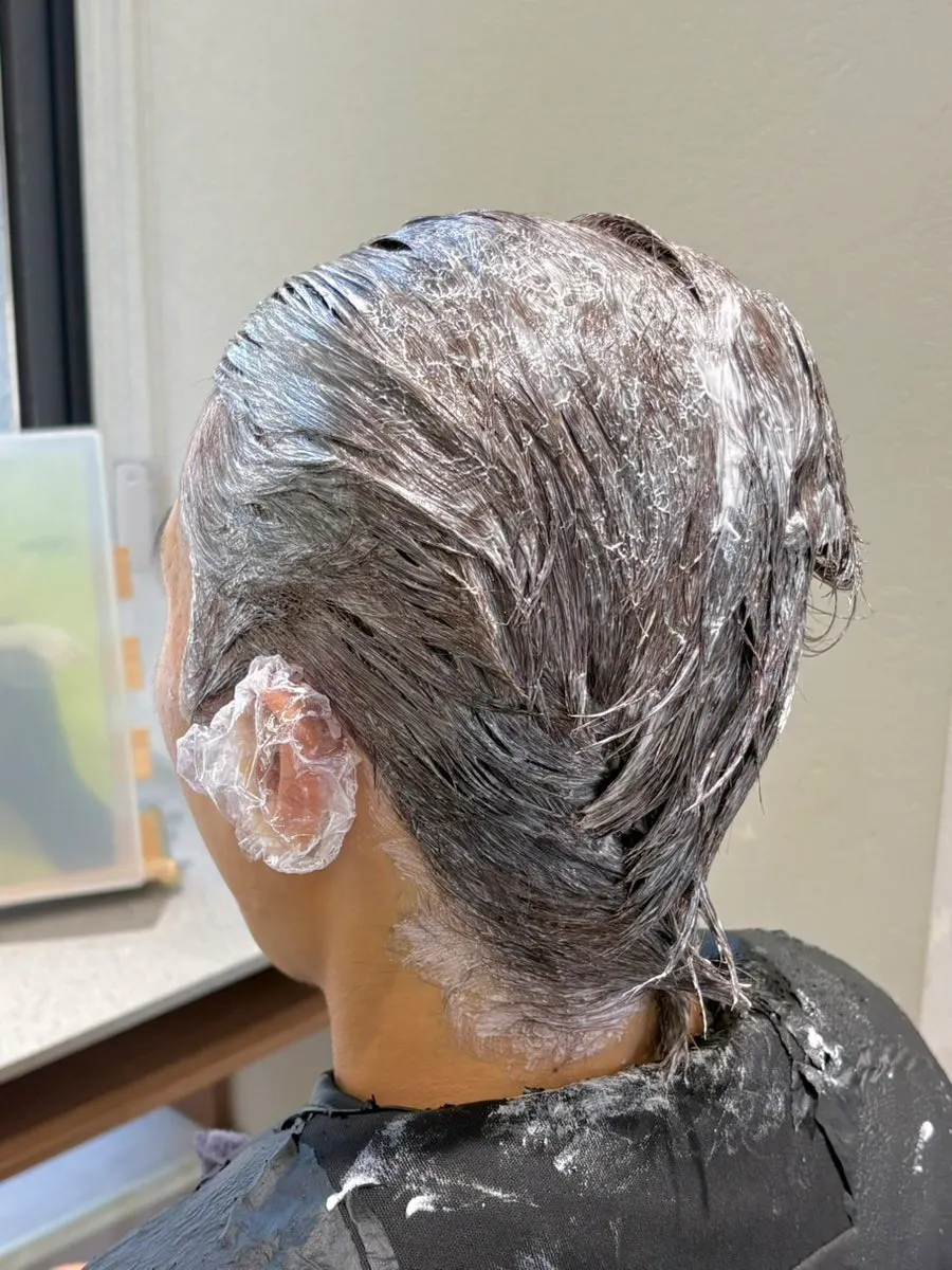 Dye carefully applied all the way to the scalp