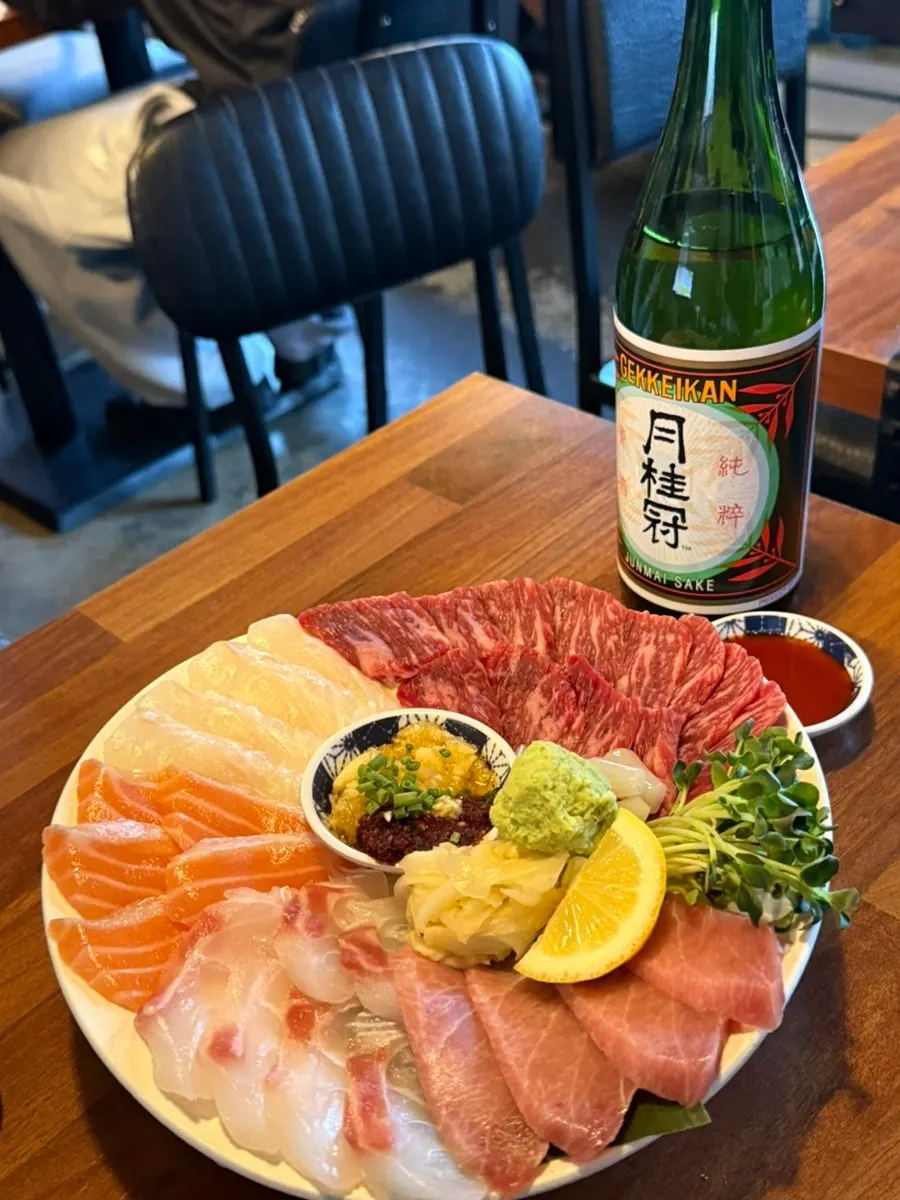 Beef sashimi served alongside the assorted platter