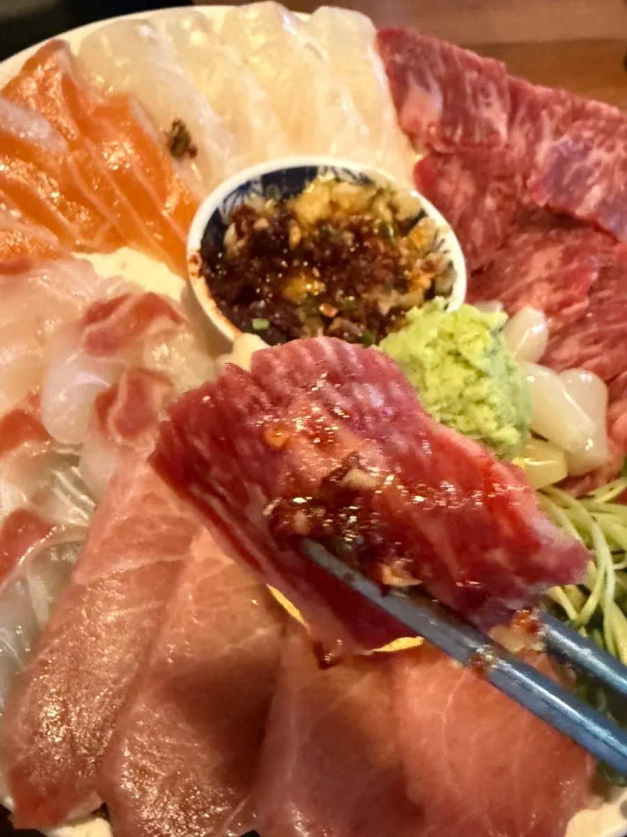 Plate of Majang-dong beef sashimi with dipping sauce