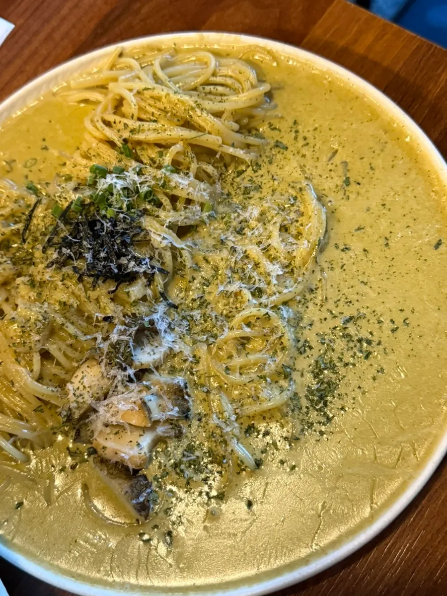 Abalone intestine cream pasta topped with abalone meat