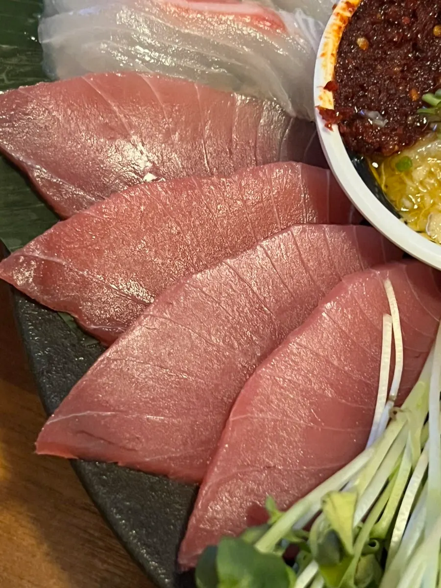 Side dishes set up for wrapping food in seaweed