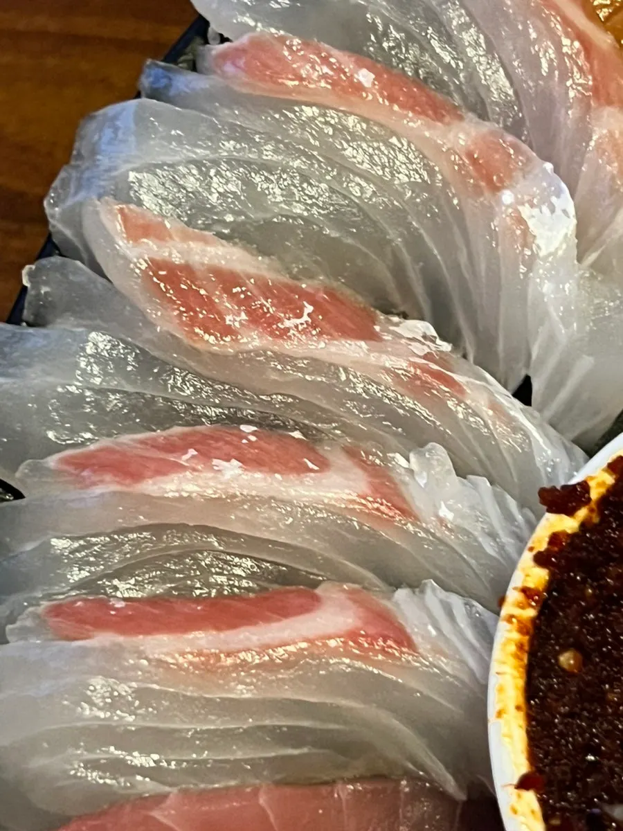Aged sashimi platter with salmon, flounder, and tuna
