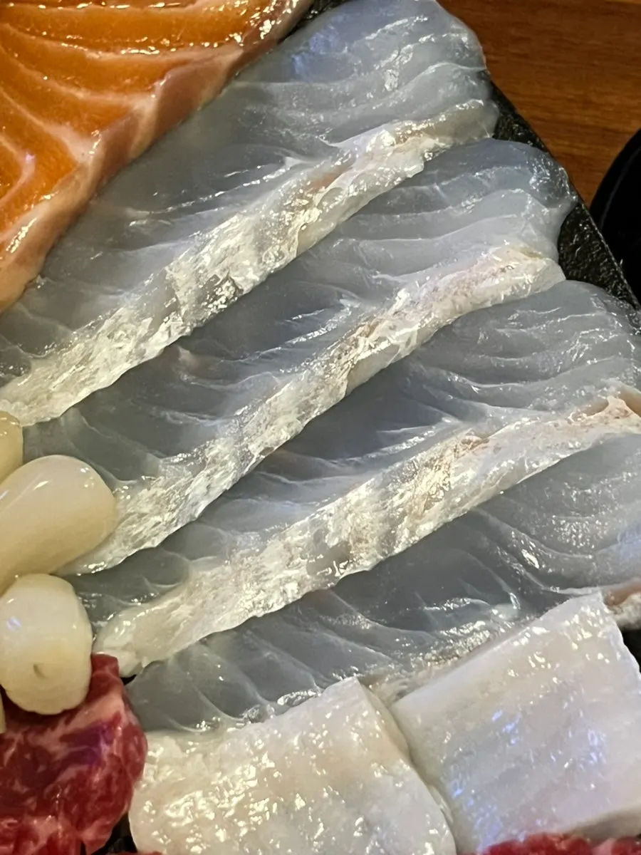 Close-up of aged sashimi including flounder fin