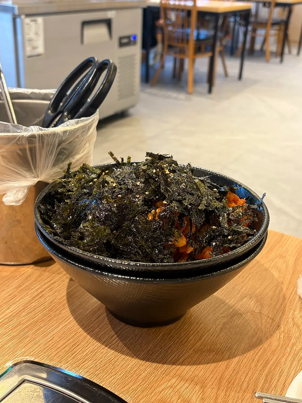 Complimentary broth served separately in a stone pot