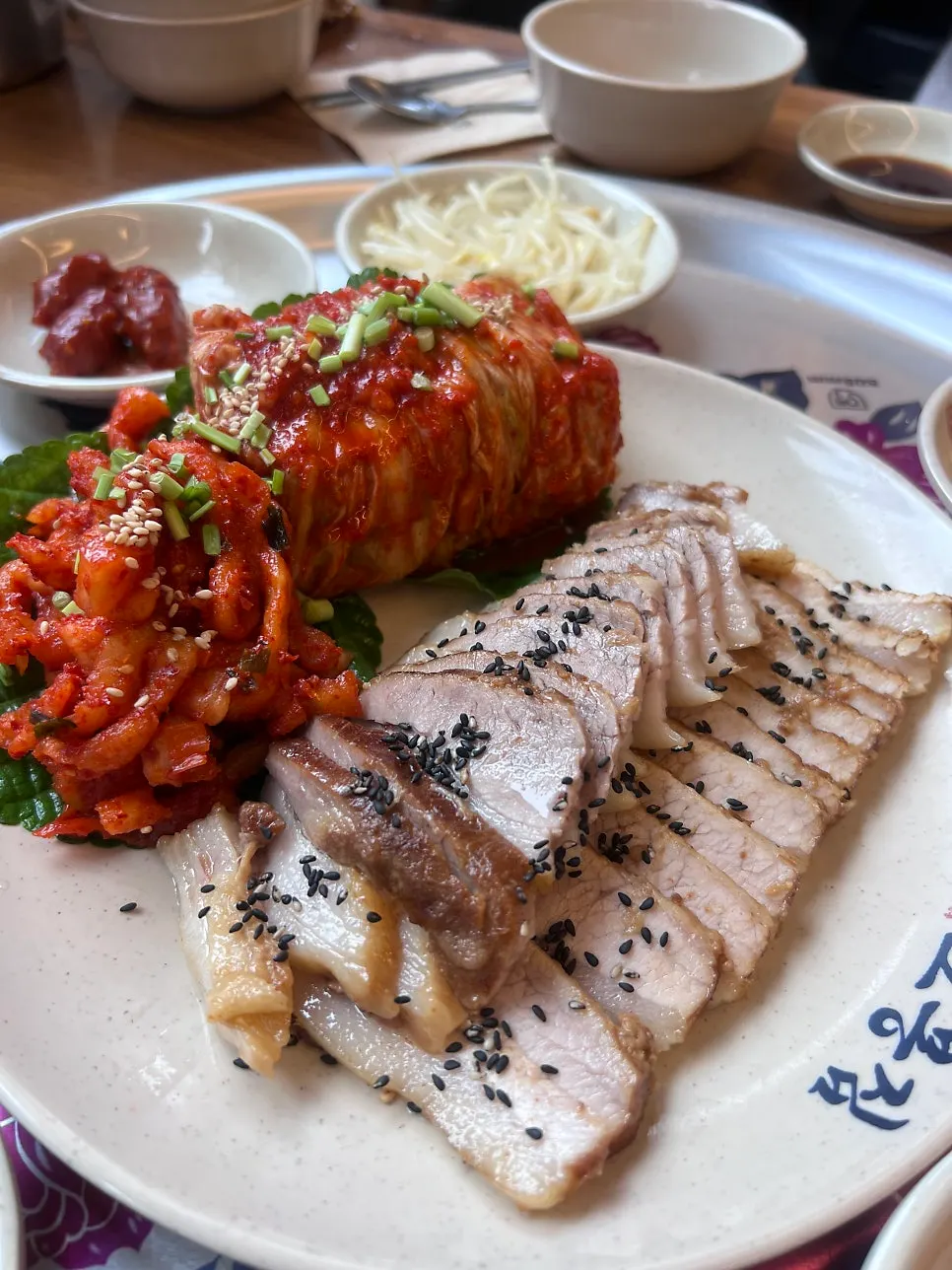 Plate of bossam served alongside the yeonpotang