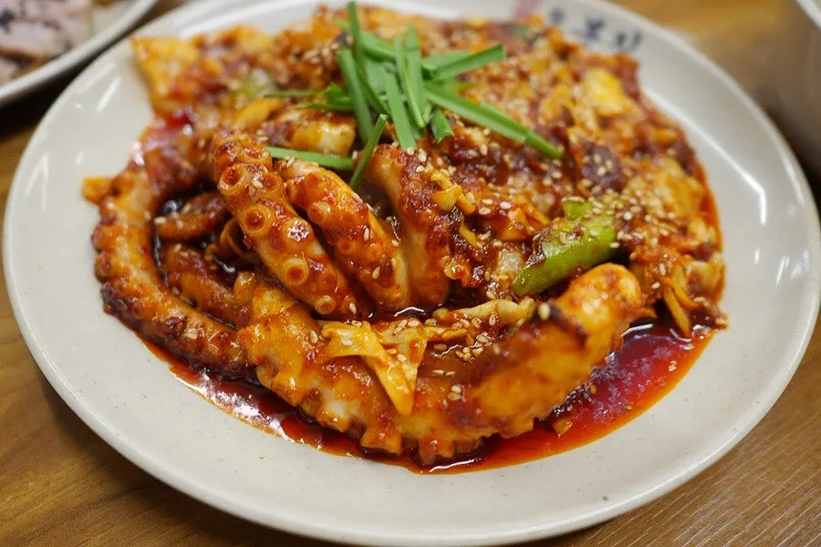 Pan of fire-grilled octopus stir-fry with thick pieces