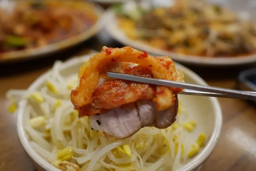 Bossam plate served with dried radish side