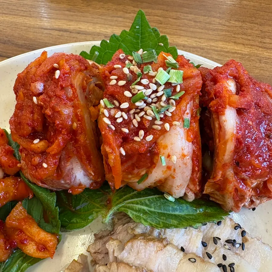 Small bossam topped with rolled bossam kimchi