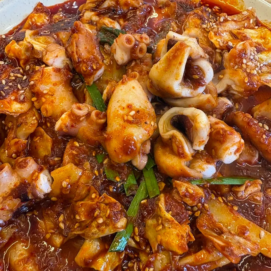Spicy octopus stir-fry with cabbage and onion