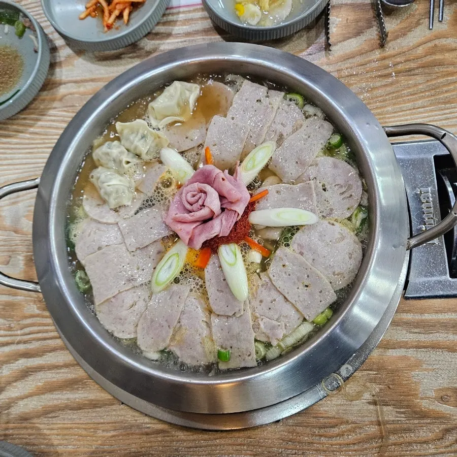 Gorae Budae Jjigae piled high with handmade ham
