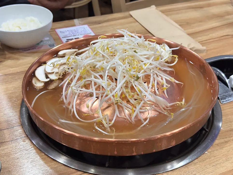 Gorae Giant Flower Beef Bulgogi over mung bean sprouts and green onion