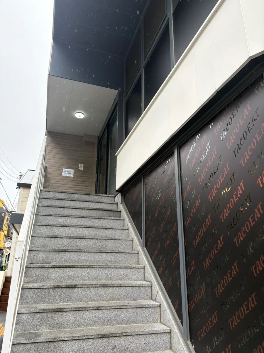 Ochaya's sign on the 2nd floor above Tacoyit