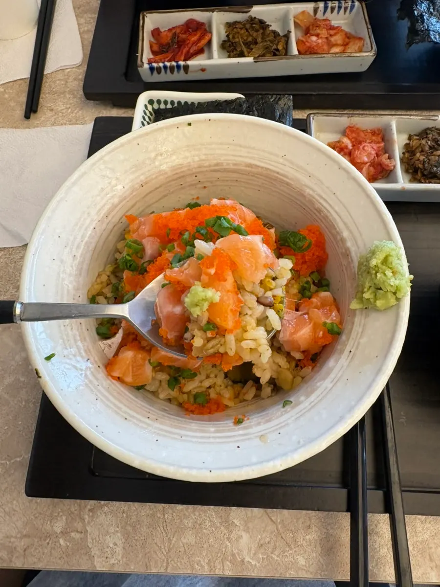 Sakechazuke with nutrient rice piled high with salmon, flying fish roe, and chives
