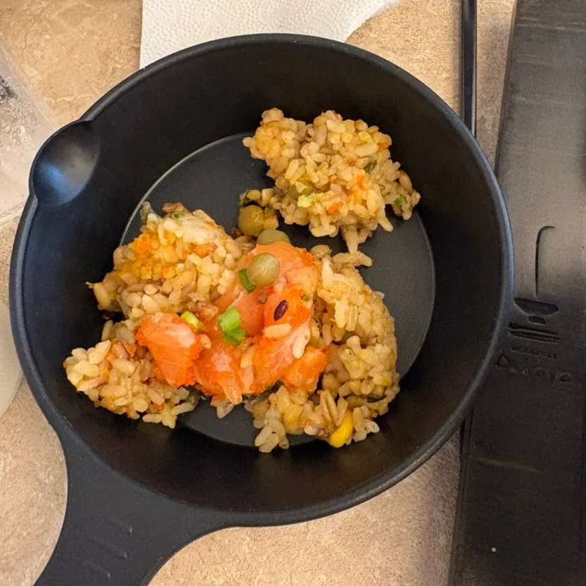 A bowl of ochazuke with rice scooped into a side plate