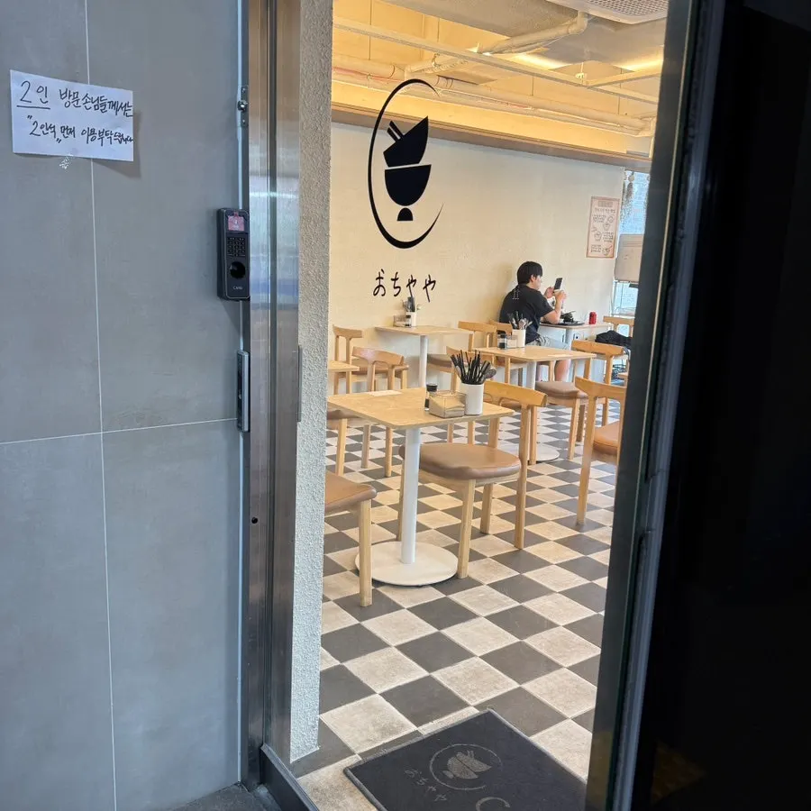 2-seat tables inside Ochaya's interior