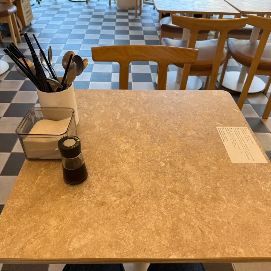 Self-serve water and aprons at Ochaya's corner station