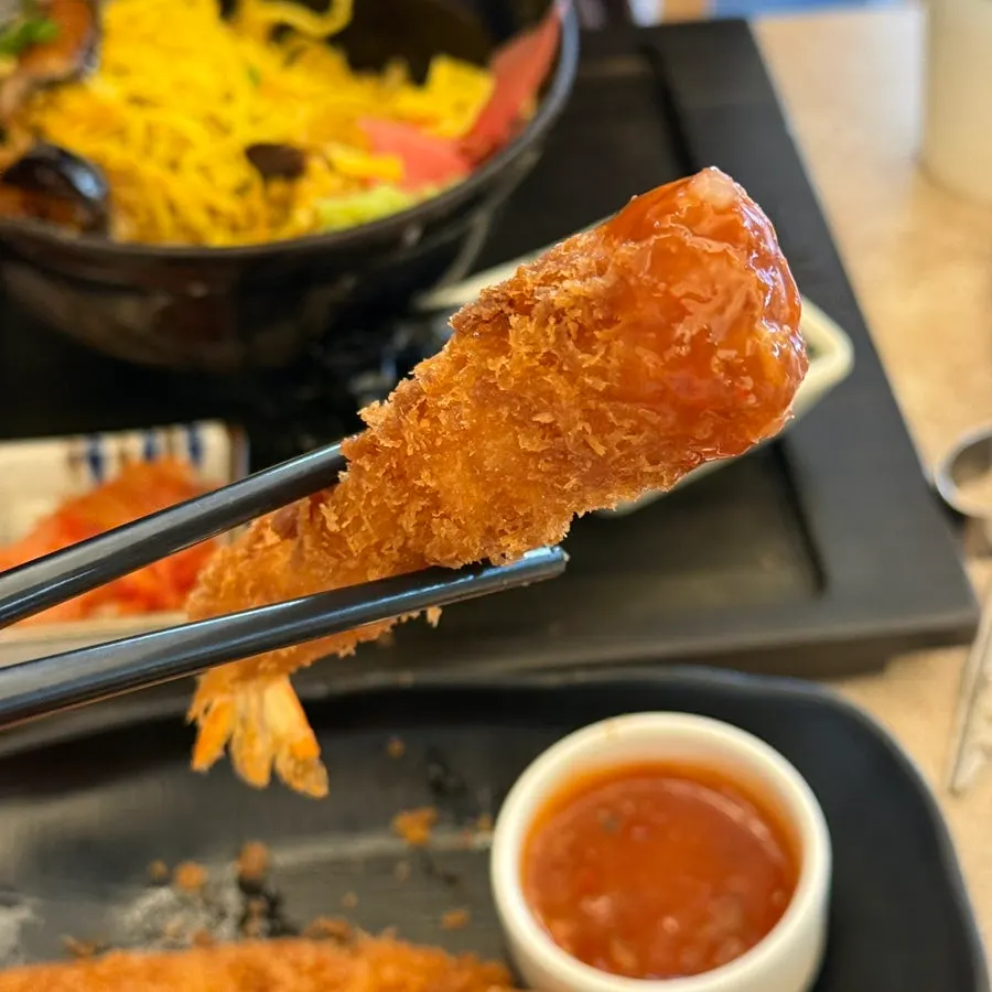 A plate of shrimp tempura served alongside ochazuke